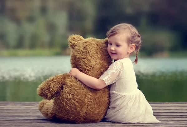 Girl with a big teddy bear
