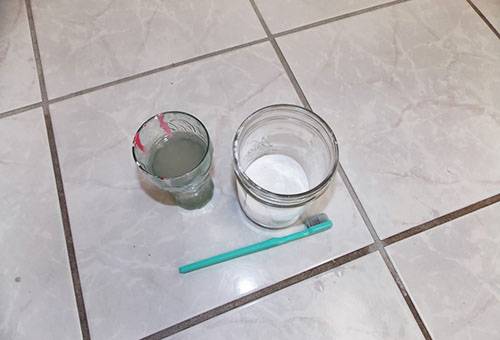 Preparing to clean joints between tiles