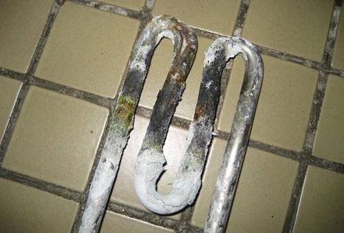 Scale on the heating element of the washing machine
