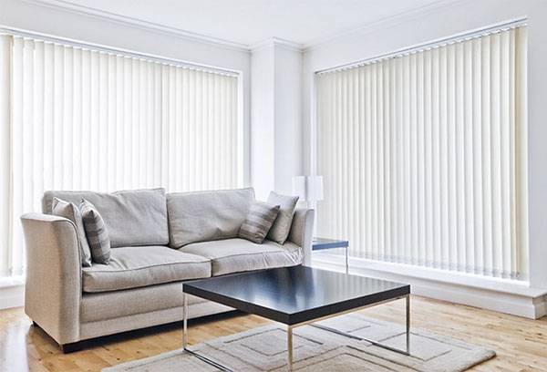 Living room with white vertical blinds