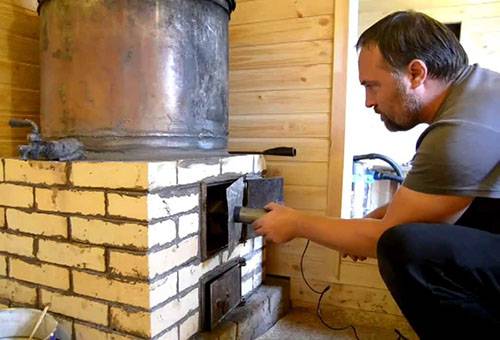 A man checks the stove