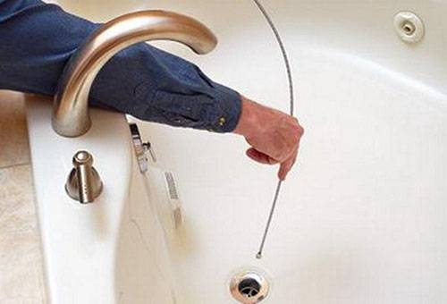Cable drain cleaning in the bathroom