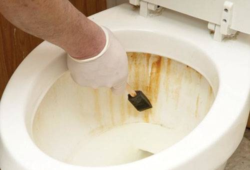 Rust on the walls of the toilet