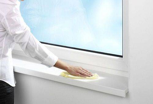 woman washes a window