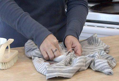 woman removes stains from clothes