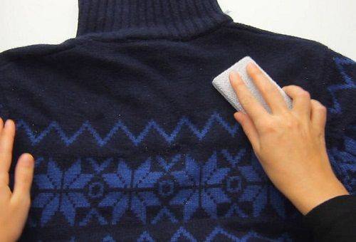 cleaning spools of clothes with a sponge