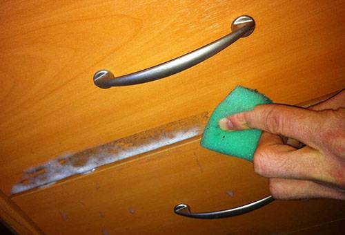 Removing the tape from the nightstand