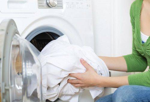 white linen in the washing machine