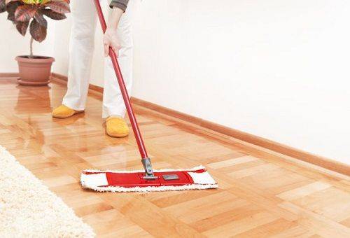 girl cleans the floor