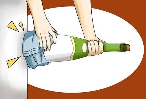 Knocking cork out of a bottle