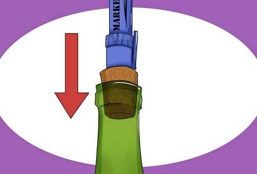 Pushing cork into a bottle of wine