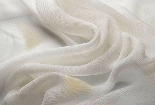 Old stains on white silk