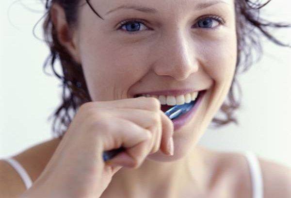 Girl brushing her teeth