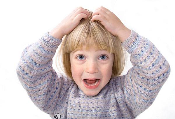 Itching the head of a child