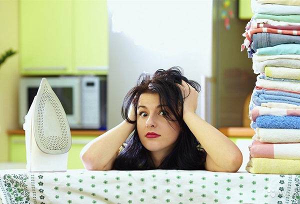 Woman tired tired of ironing