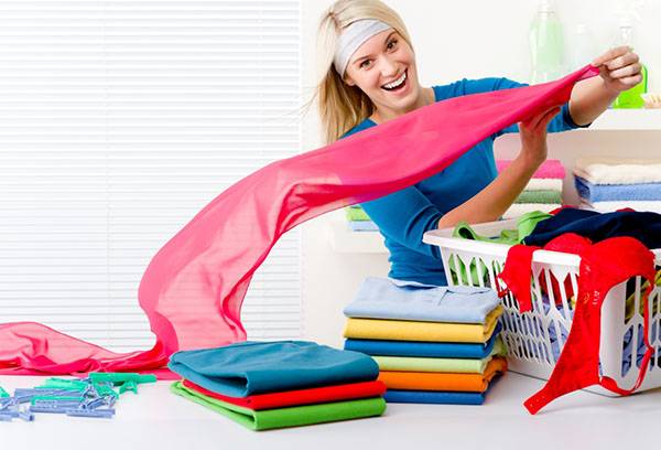 Girl lays clean clothes