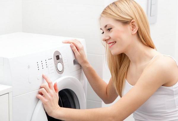 girl at the washing machine