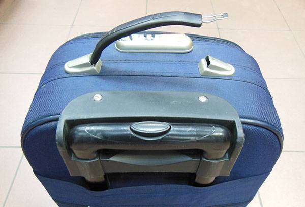 Broken handle of a suitcase