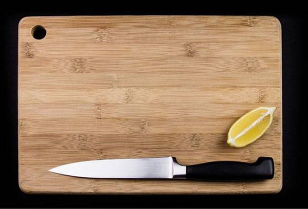 Wooden cutting board and knife