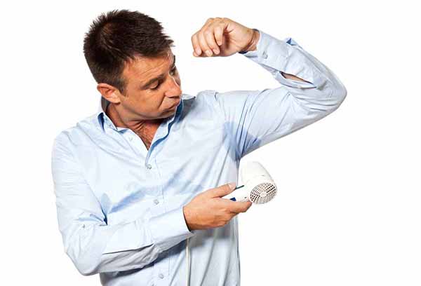 Man dries armpits