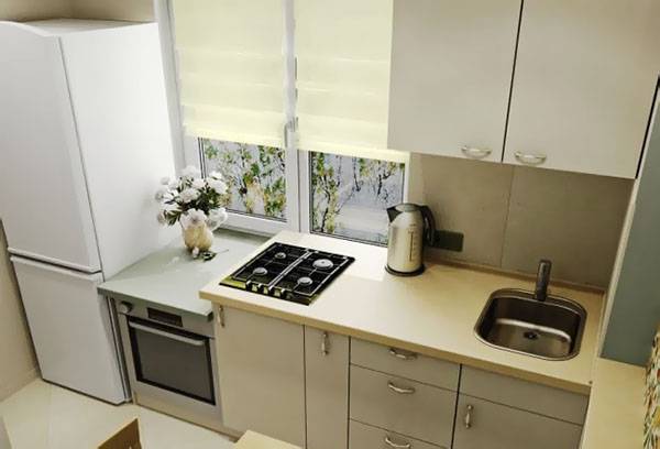 Refrigerator next to the oven