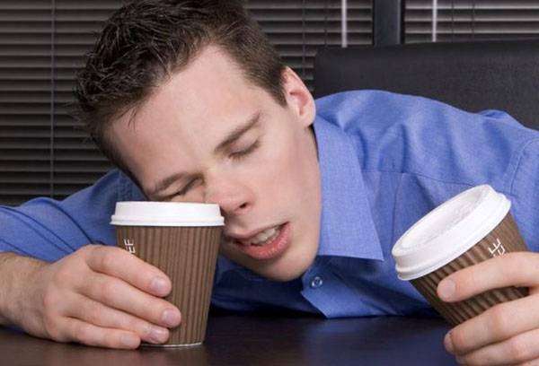 A man falls asleep at work