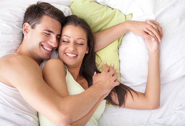 Young couple on a comfortable bed