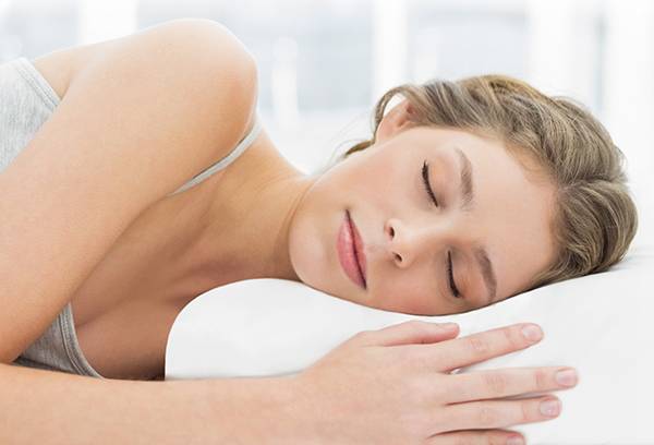 Girl sleeping on an orthopedic pillow