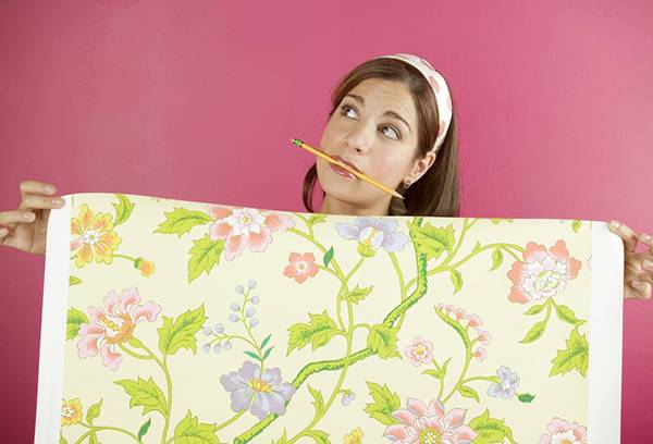 Girl plans wallpapering