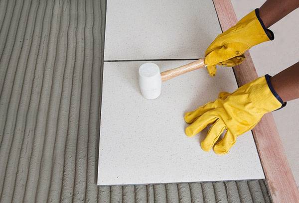 Installation of floor tiles