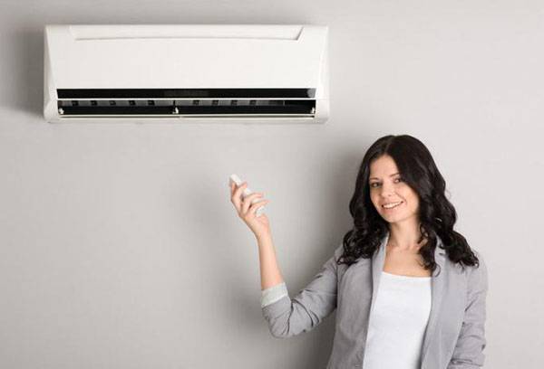 Girl turns on air conditioning