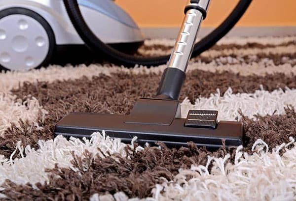 Vacuuming a carpet