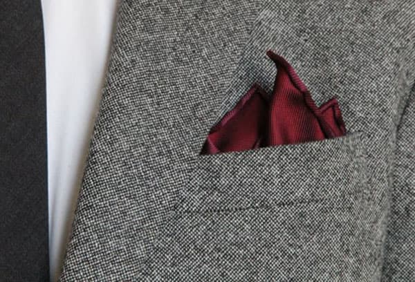 Silk scarf in the pocket of a man's jacket