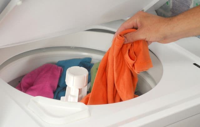 Loading clothes into the machine