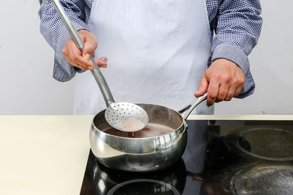 Man cooks buckwheat
