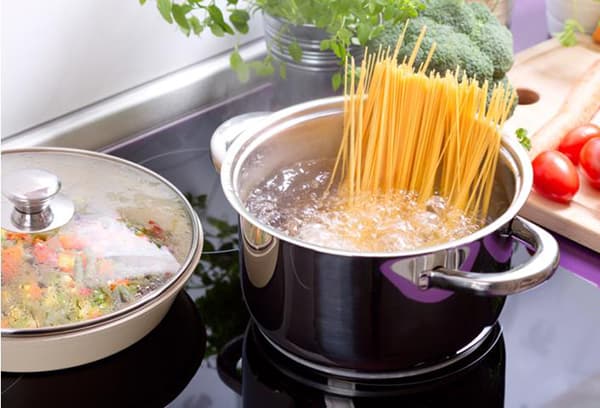 spaghetti in a pan on the stove