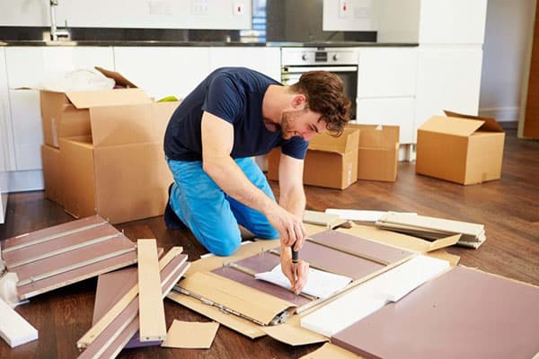 A man collects furniture