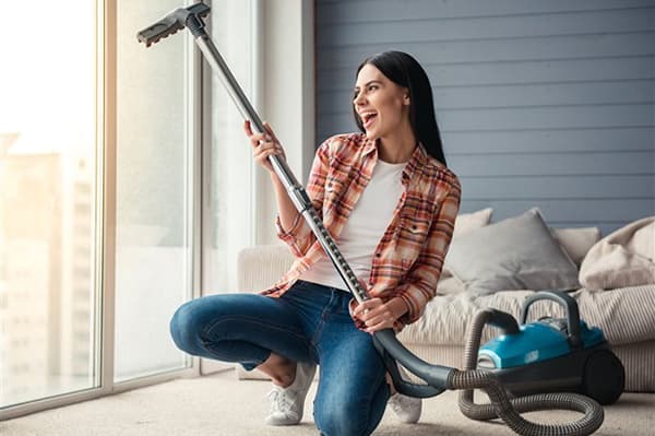 Girl with a vacuum cleaner