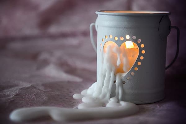 Wax from a candle flows down on fabric