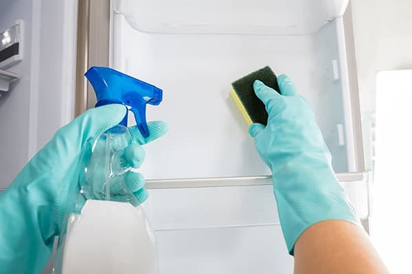 Washing the fridge