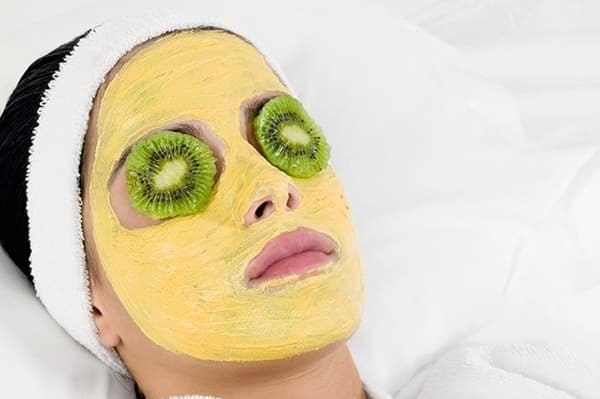 Girl with a cosmetic mask on her face.