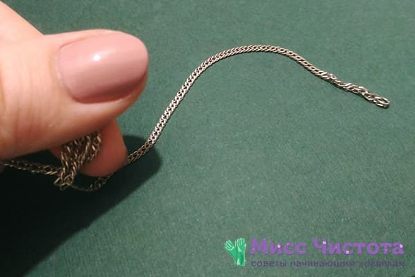 Unraveling a knot on a silver chain