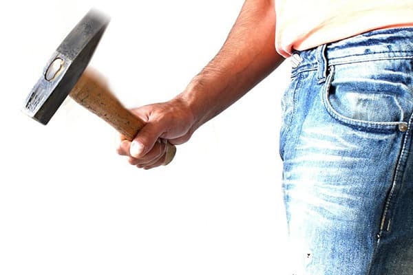 Man holding a hammer