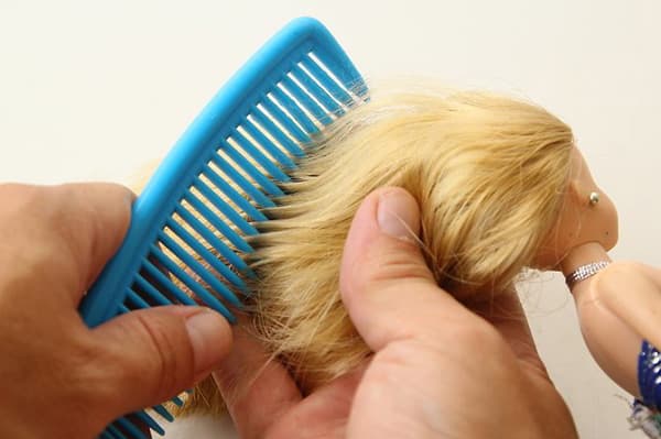 Combing hair doll