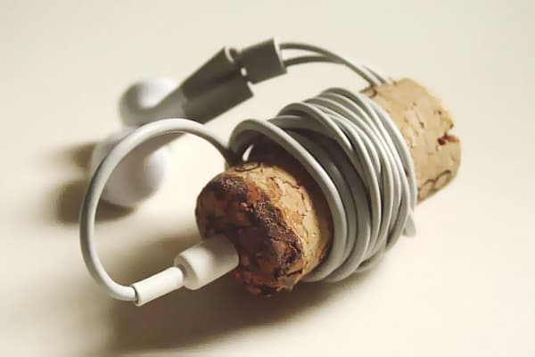 Storing headphones on a wine cork