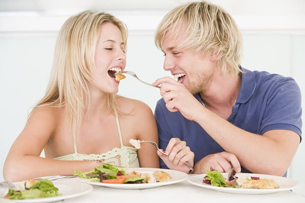 Couple eats from the same plate