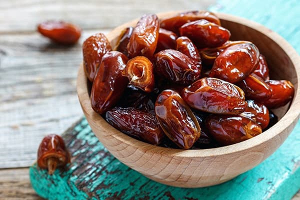 Wooden bowl with dates