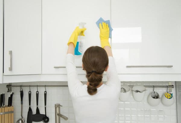 Cleaning the kitchen cabinets