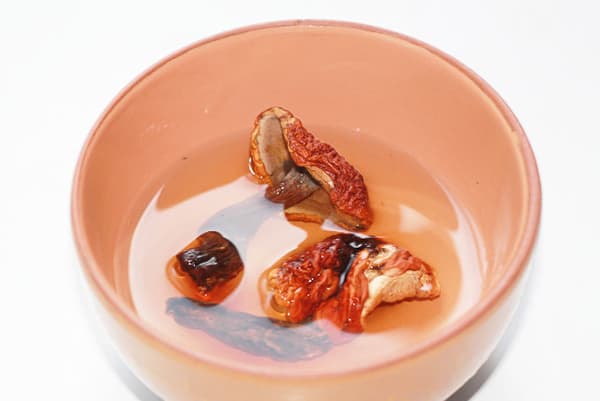 Dried mushrooms in a bowl with water