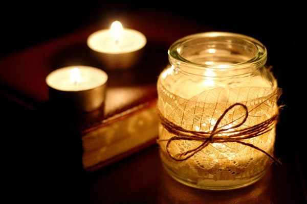 Candle in a jar of baby food